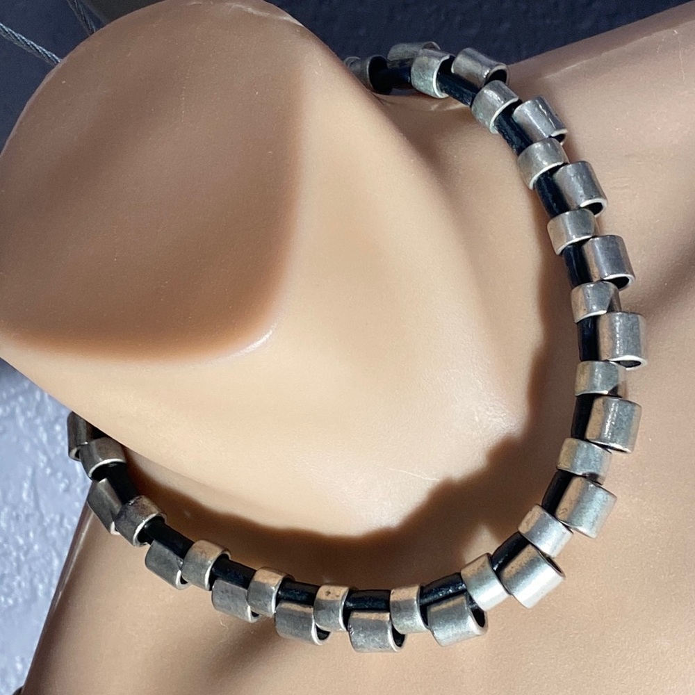ESCAPE FROM PARIS - signed necklace w heavy silver tubes & leather cords, adj.
